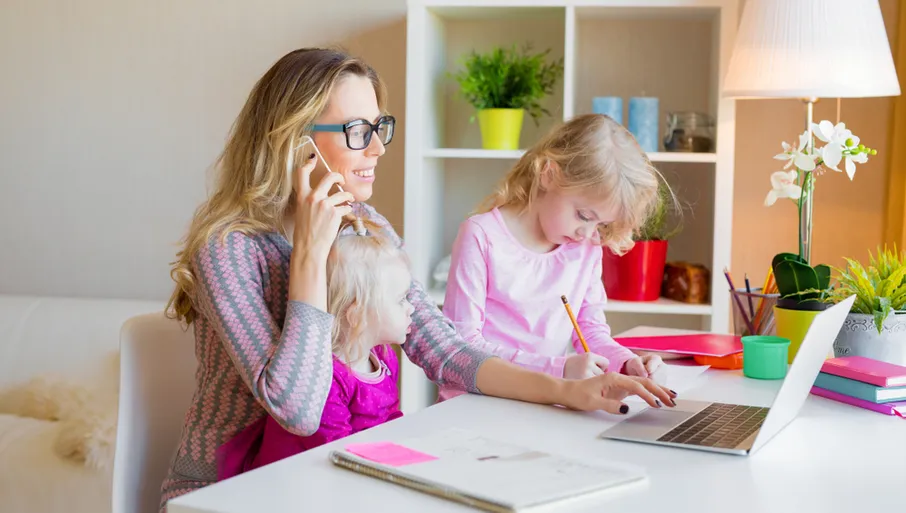 mother entrepreneur working from home office